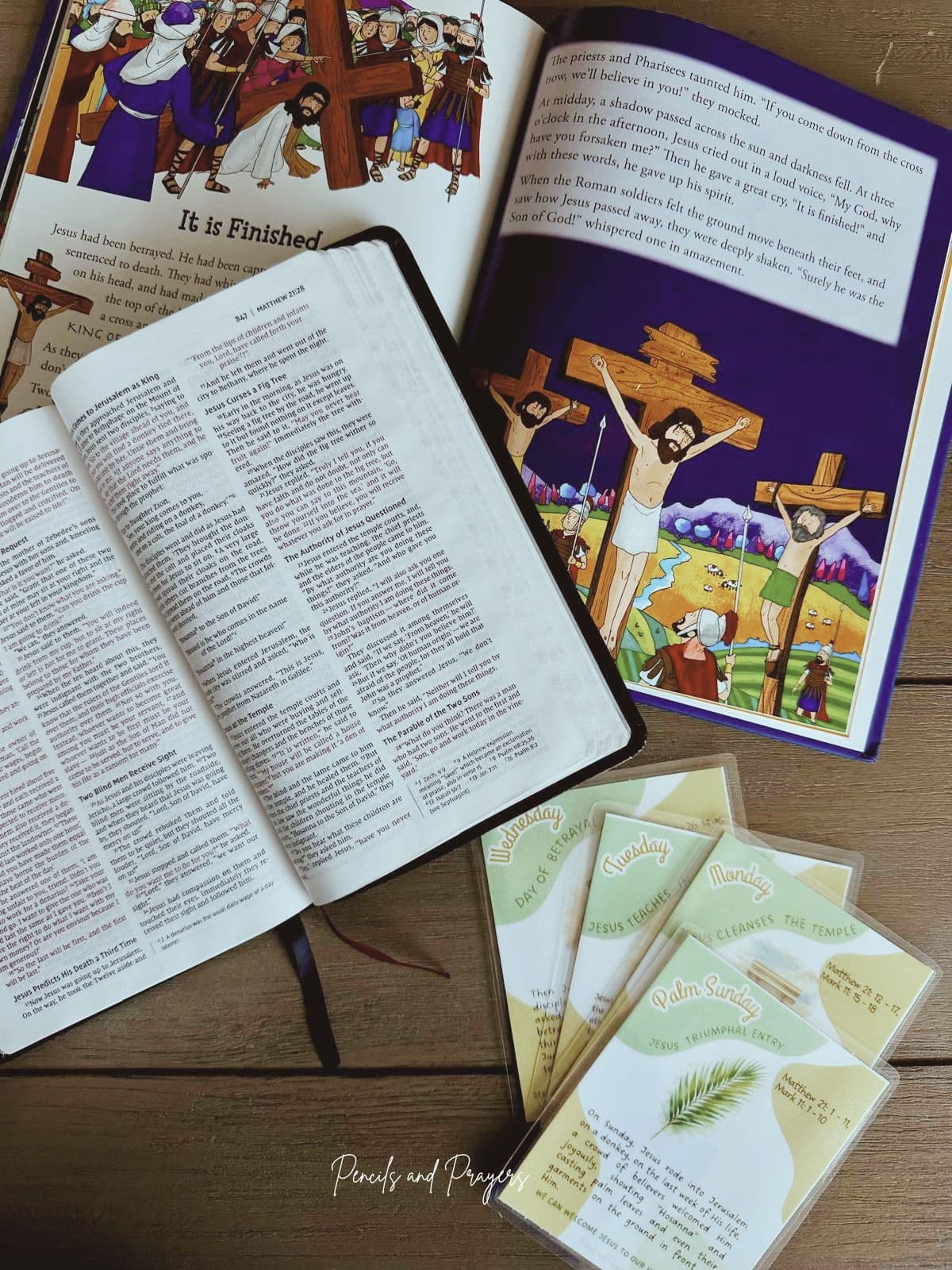 Bible, illustrated crucifixion page, and Holy Week cards